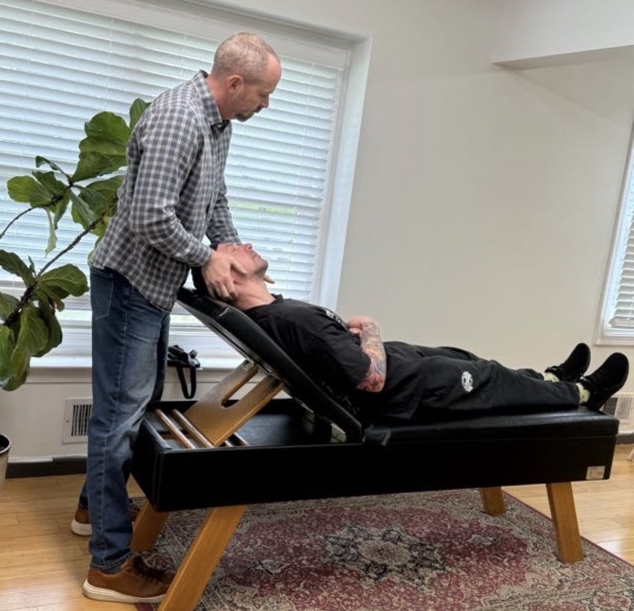 Dr. Tom performing a cervical adjustment
