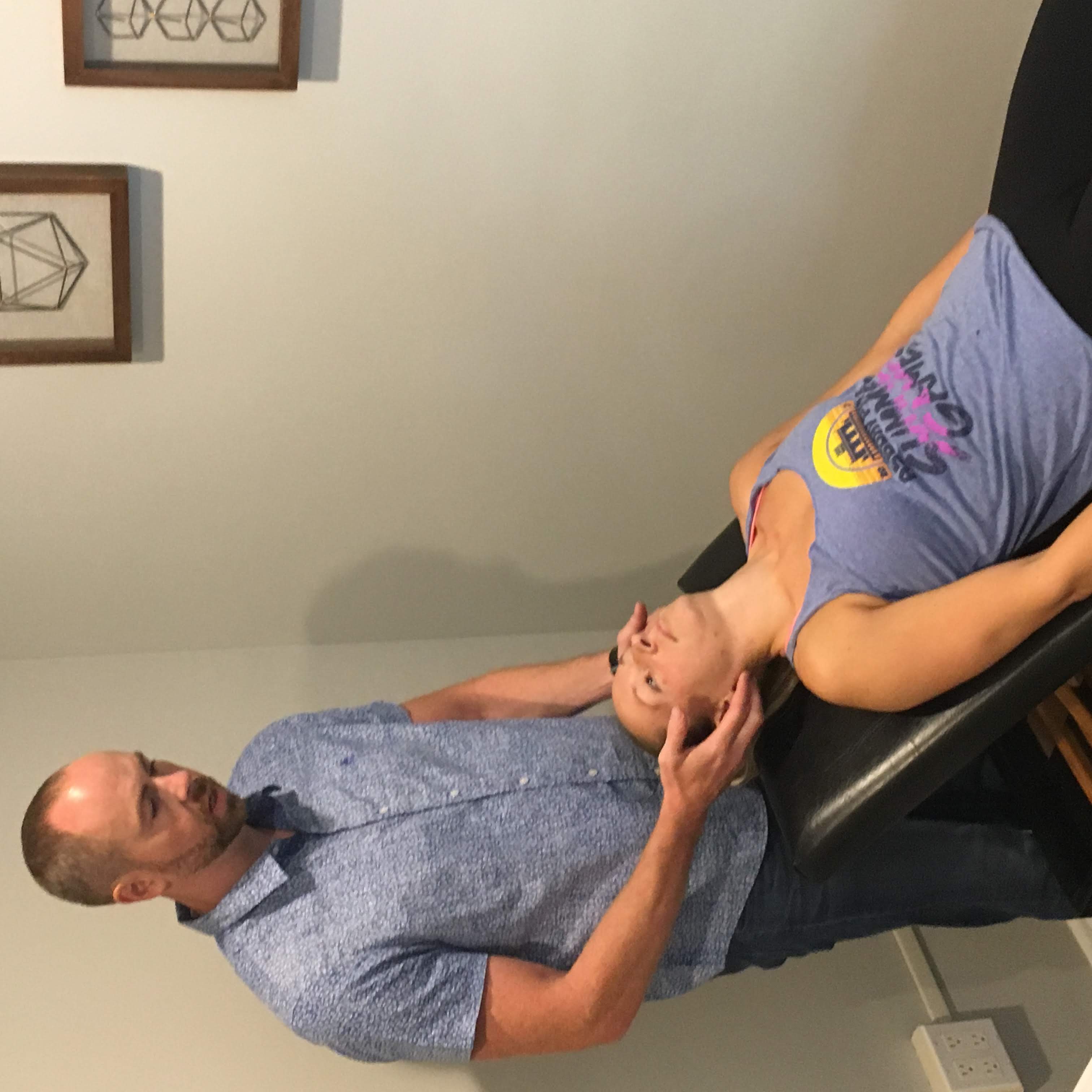 Dr. Tom performing a cervical adjustment
