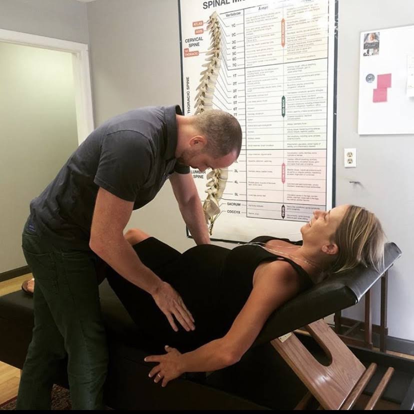 Adjustment session with spinal chart